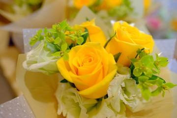 Romantic Flower bouquet arrangement with bright yellow rose and fresh green leaf