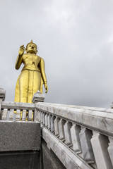 Obraz premium Phra Buddha Mongkol Maharaj tallest Golden Standing Buddha at Hat Yai Municipal Park, Hat Yai Thailand