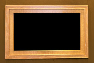 Wooden frame on wooden wall
