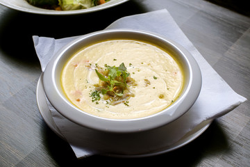 Pumpkin crab soup on a white bowl