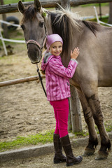 Young horse riding girl, equestrian sport . Horseback girl on field.