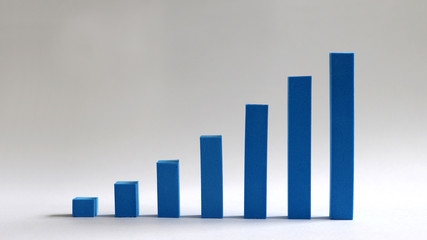 A blue bar graph handmade on a soft background.