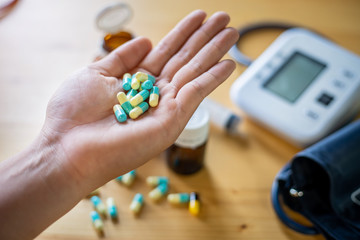 Colorful pills and medicines in the hand , Pressure Gauge background