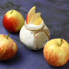 Food. Milk product. Creamy yogurt in a jar with fresh juicy fruit pears and apples for a healthy diet.