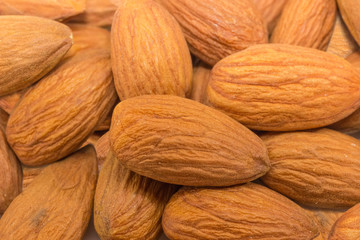 Background of the almonds peeled from shells closeup