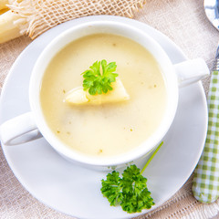asparagus cream soup with capers and fresh baguette