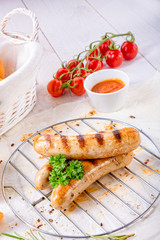 delicious bratwurst with ketchup and fresh rolls