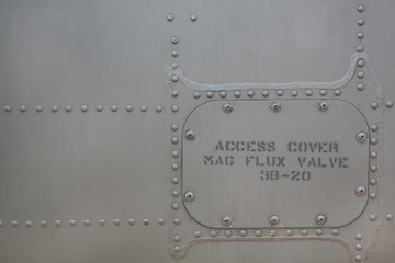 Metal surface background of military aircraft with cover.