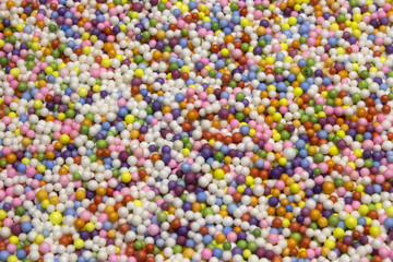 Fototapeta na wymiar Small Colorful Polysterene balls background