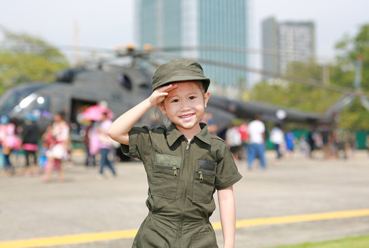 Little Asian Child Girl In Pilot Soldier Suit Costume. Dream Job Concept.