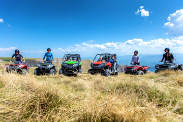 Friends driving off-road with quad bike or ATV and UTV vehicles © FS-Stock