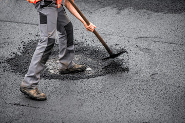 macadam worker on the road