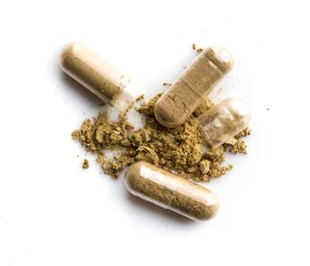 Foto auf Acrylglas Herbal medicine powder in capsule on white background © showcake