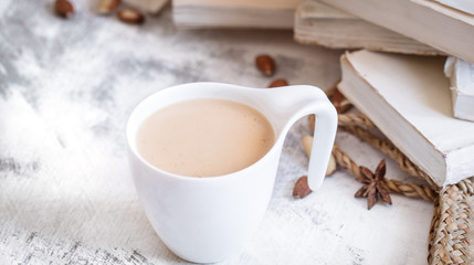 a cup of coffee with books