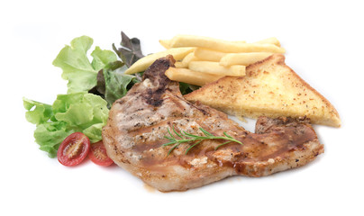 Grilled pork with french fries and salad isolated on white background