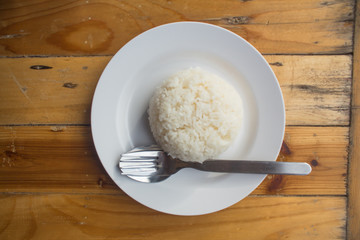 Jasmine Rice cooked rice at Phuket Thailand,Wood background, brown
