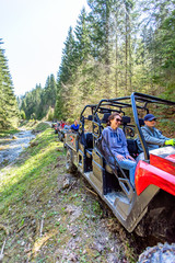 A tour group travels on ATVs and UTVs on the mountains © FS-Stock