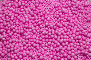Fototapeta premium Small and Large Pink Polysterene balls background