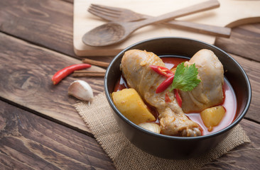 Spicy Muslim chicken curry,Thai massaman curry in a bowl on wood background