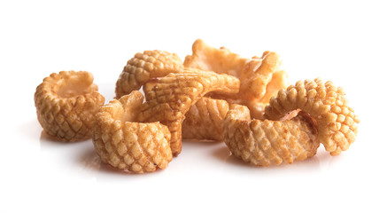 Crunchy corn snacks on a white background