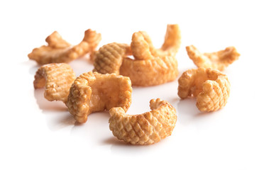 Crunchy corn snacks on a white background