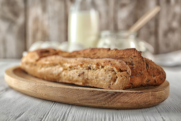 Loaf of bread on table. Fresh from oven