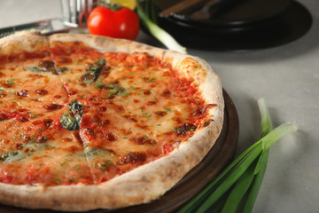 Tasty pizza on table. Fresh from oven