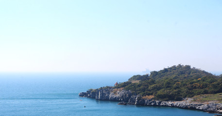 Beach, sea waves and blue sea at Sichang Island, Chonburi, Thailand