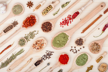 spices and herbs on kitchen wooden table background. food, cooking and restaurant concept. top view, flat lay