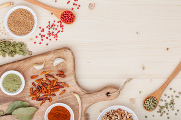 spices and herbs on kitchen wooden table background with copy space for text. food, cooking and restaurant concept. flat lay frame composition, top view