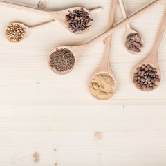 spices and herbs on kitchen wooden table background with copy space for text. food, cooking and restaurant concept. flat lay composition, top view