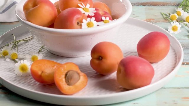 Delicious ripe apricots fruit on wooden background close up.