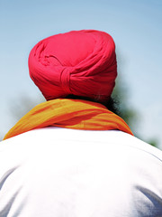 man with beard and red turban