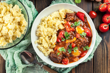 Hungarian beef goulash serwed with galuska noodles