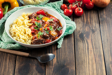 Hungarian beef goulash serwed with galuska noodles
