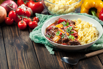 Hungarian beef goulash serwed with galuska noodles