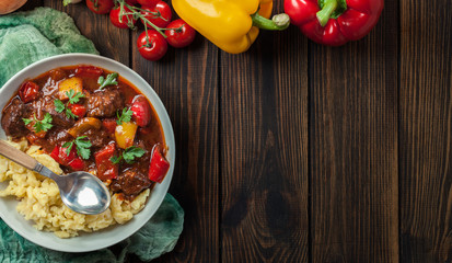 Hungarian beef goulash serwed with galuska noodles