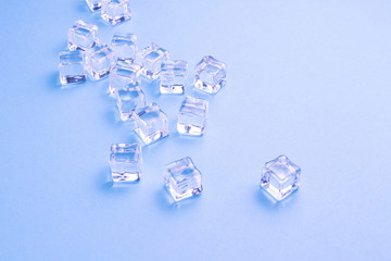 Ice cubes on a light blue background