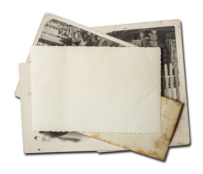 Stack of old photos. Isolated on white background with clipping path included.