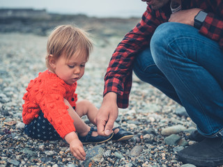 Father and son relaxing on the beach
