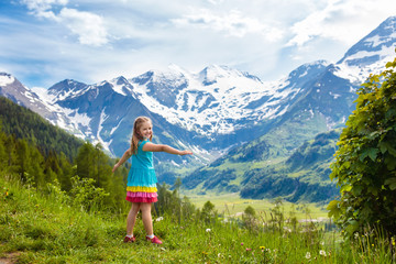Naklejka premium Children hiking in Alps mountains. Kids outdoor.