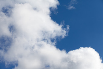 White fluffy clouds in the blue sky