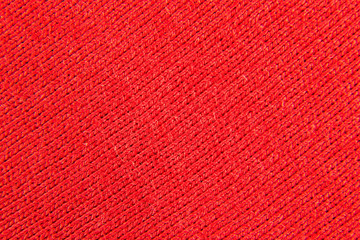 Fototapeta premium background of a fabric of red color weaving close-up