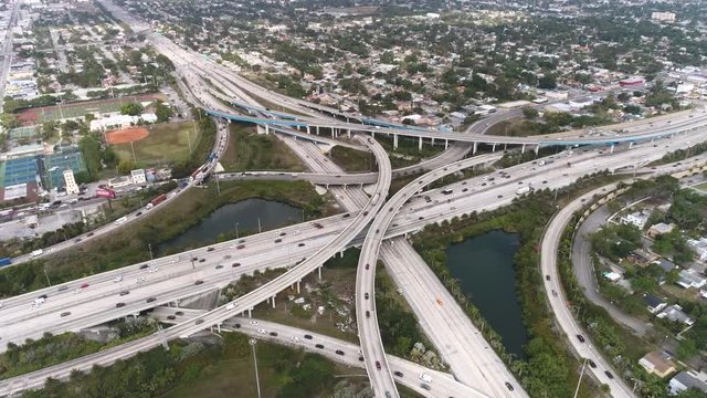 Aerial shot of highway intersection, I-95 and MacArthur Causeway. Aerial view of Miami freeway junction.