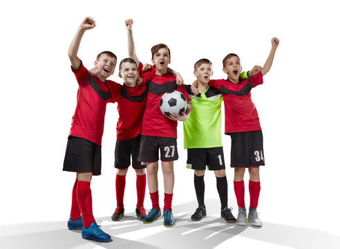 five teenage soccer players celebrating victory isolated on white