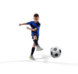 Fototapeta na wymiar football player kid kicking the ball