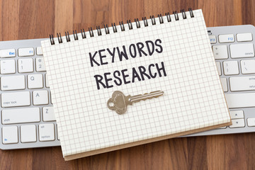 Keywords research with key on computer keyboard