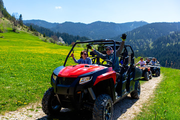 A tour group travels on ATVs and UTVs on the mountains © FS-Stock