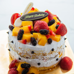 Homemade fruit cake with Happy birth day tag chocolate.