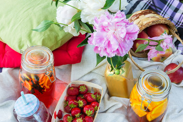 Picnic in the outdoor with strawberry and cold beverages